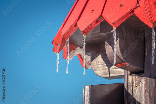 Closeup of wooden colorful mountain sign, Western Tatra Mountains, border between Poland and Slovakia. Selective focus on the details of wood, blurred background.