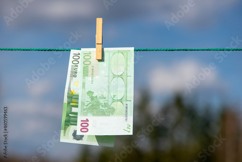 Photos 100 and 50 euro banknotes drying