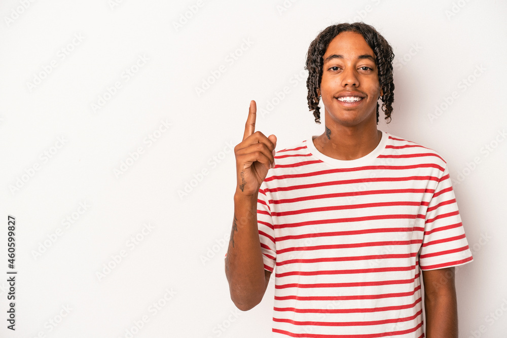 Young african american man isolated on white background showing number one with finger. Young african american man isolated on white background showing number one with finger.