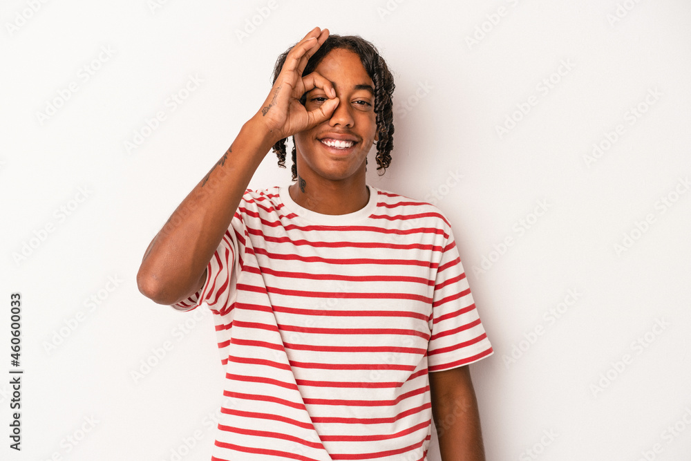 Young african american man isolated on white background excited keeping ok gesture on eye. Young african american man isolated on white background excited keeping ok gesture on eye.