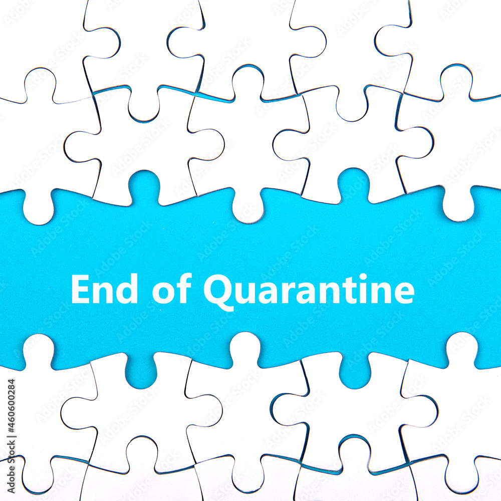 White puzzle background with pieces missing. Words END OF QUARANTINE. End of coronavirus and quarantine concept White puzzle background with pieces missing. Words END OF QUARANTINE. End of coronavirus and quarantine concept