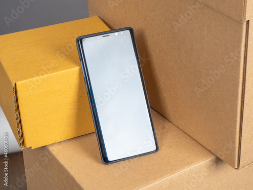 Smartphone on cardboard box...