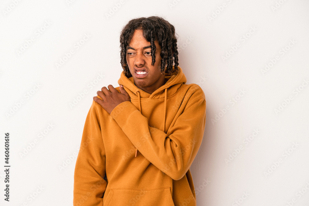 Young african american man isolated on white background having a shoulder pain. Young african american man isolated on white background having a shoulder pain.