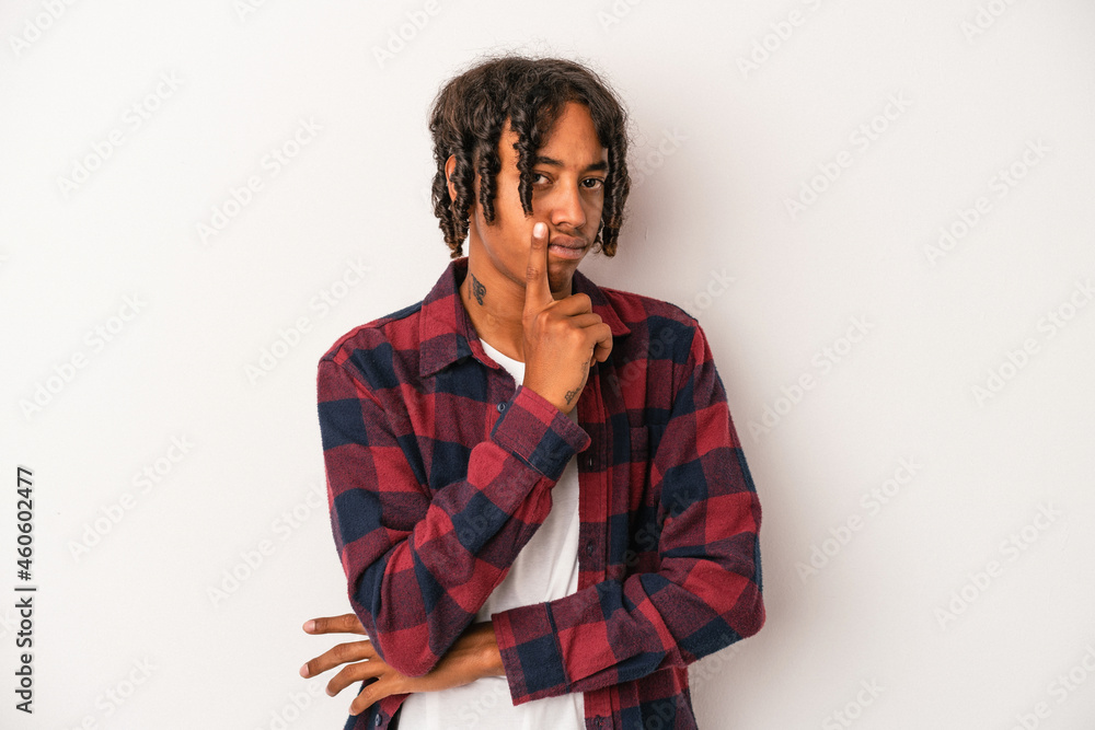 Young african american man isolated on white background contemplating, planning a strategy, thinking about the way of a business. Young african american man isolated on white background contemplating, planning a strategy, thinking about the way of a business.