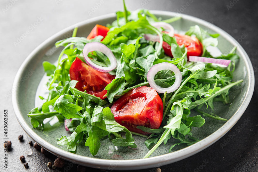 arugula and tomato salad vegetable in a plate fresh meal snack on the table copy space food background rustic veggie vegan or vegetarian food