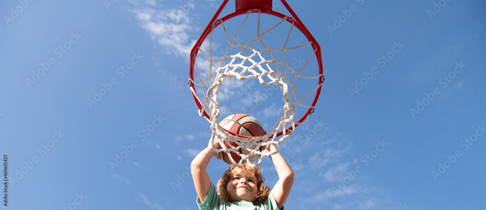 Φωτογραφία Kid boy playing basketball, banner with copy space