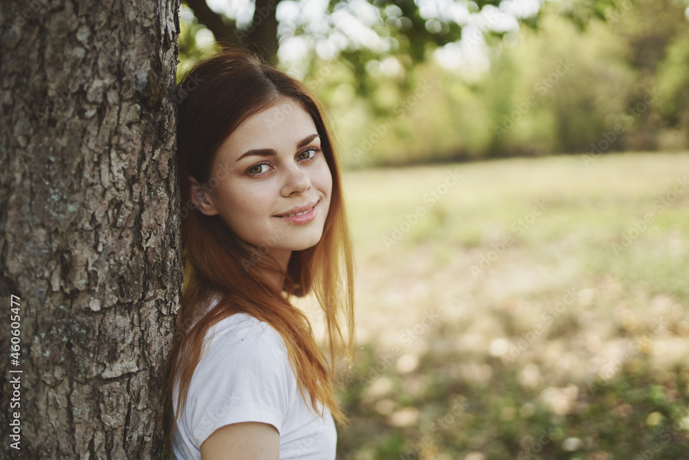cheerful woman near the tree nature Sun freedom journey cheerful woman near the tree nature Sun freedom journey
