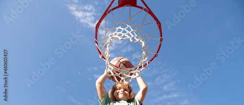 Φωτογραφία Kid boy playing basketball, banner with copy space