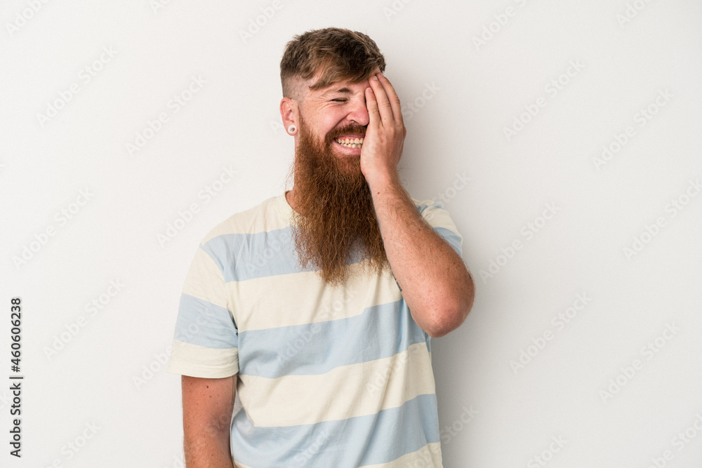 Young caucasian ginger man with long beard isolated on white background laughing happy, carefree, natural emotion. Young caucasian ginger man with long beard isolated on white background laughing happy, carefree, natural emotion.