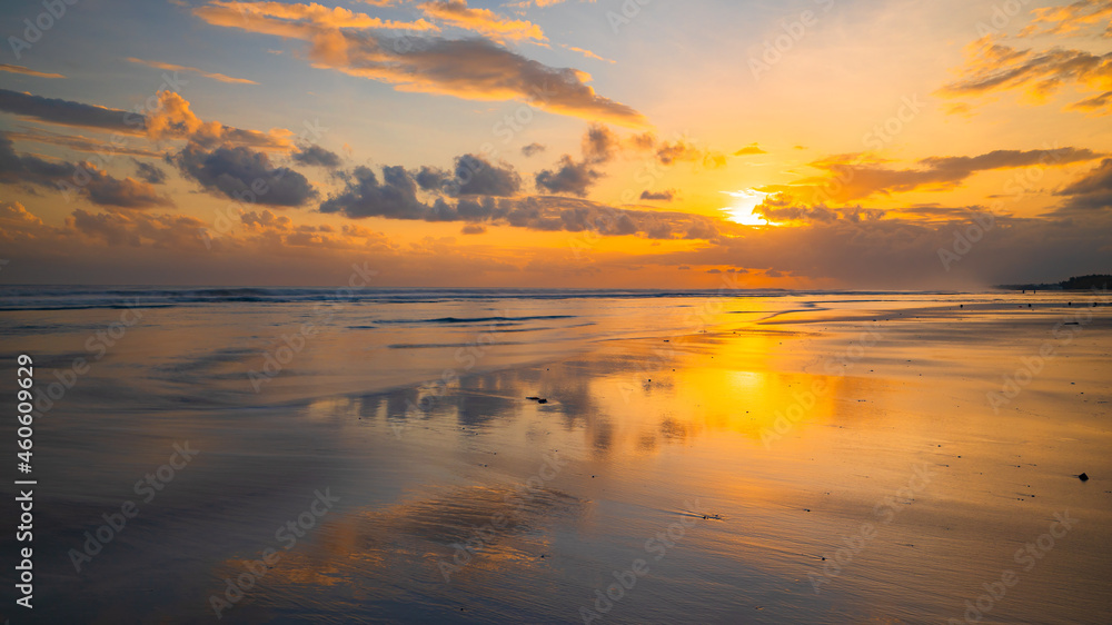 Sunset time. Seascape background. Bright sunlight. Sun at horizon line. Scenic view. Sunset golden hour. Sunlight reflection in water. Beautiful nature. Copy space. Kelanting beach, Bali