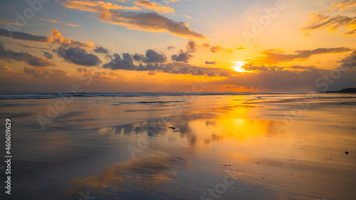 Sunset time. Seascape background. Bright sunlight. Sun at horizon line. Scenic view. Sunset golden hour. Sunlight reflection in water. Beautiful nature. Copy space. Kelanting beach, Bali