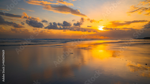 Sunset time. Seascape background. Bright sunlight. Sun at horizon line. Scenic view. Sunset golden hour. Sunlight reflection in water. Magnificent scenery. Copy space. Kelanting beach, Bali