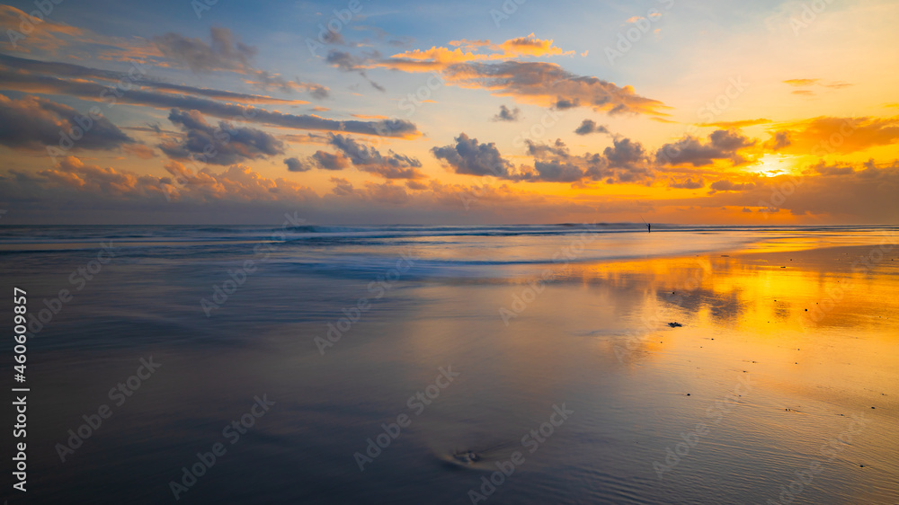 Sunset time. Seascape background. Cloudy sky. Scenic view. Sunset golden hour. Sunlight reflection in water. Magnificent scenery. Beautiful nature. Copy space. Kelanting beach, Bali