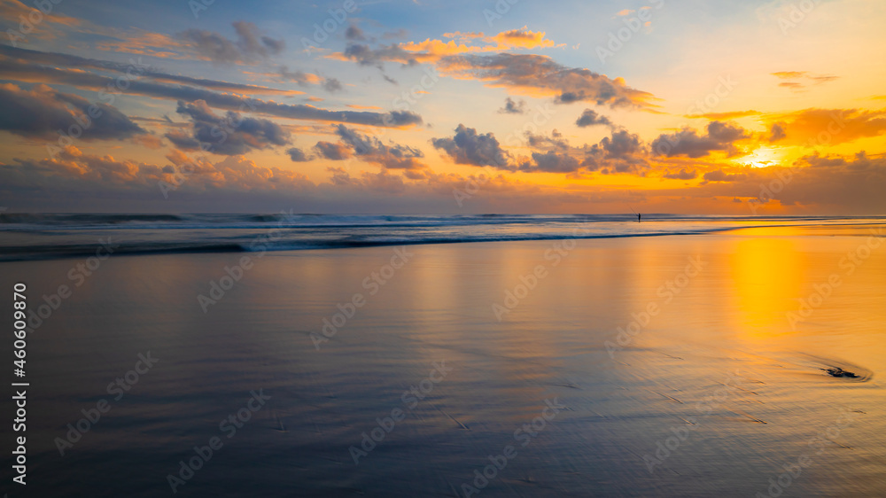 Sunset time. Seascape background. Cloudy sky. Scenic view. Sunset golden hour. Sunlight reflection in water. Magnificent scenery. Magnificent scenery. Copy space. Kelanting beach, Bali