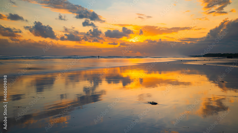 Sunset time. Seascape background. Cloudy sky. Scenic view. Sunset golden hour. Sunlight reflection in water. Magnificent scenery. Beautiful nature. Copy space. Kelanting beach, Bali
