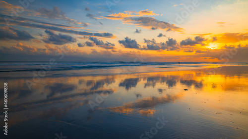 Sunset time. Seascape background. Cloudy sky. Scenic view. Sunset golden hour. Sunlight reflection in water. Magnificent scenery. Magnificent scenery. Copy space. Kelanting beach, Bali © Olga