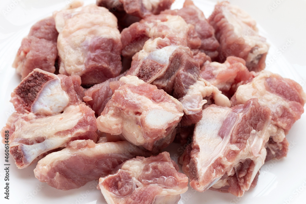 Raw pork ribs on white background.