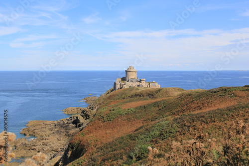 fort la latte at a colorful rock goyon at the french coast in bretagne with a deep blue sea in the background © Angelique