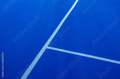 Lines, blue paddle tennis court field background © Vic