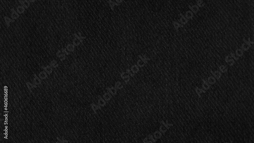 black fabric texture background. close up detail of canvas textile material with blank space for design. dark fabric texture. clothes background. © WONGSAKORN