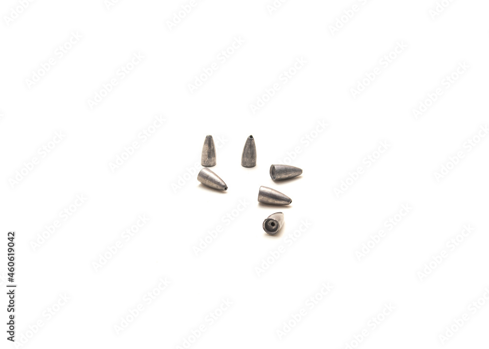 Pile of lead bullet weights with concave bases to fit worm noses isolated on white Pile of lead bullet weights with concave bases to fit worm noses isolated on white