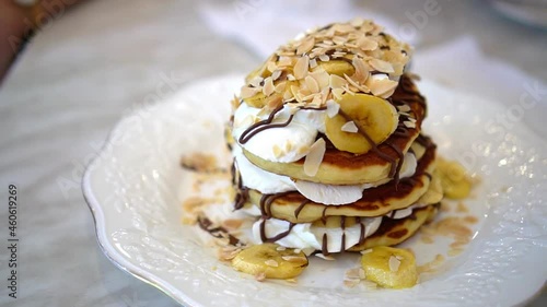 banana chocolate almond on fluffy soft pancake 