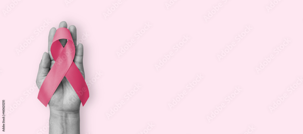 Pink ribbon for breast cancer awareness in October, wear pink day charity for woman health fighting with breast tumor illness (bow isolated with clipping path on white background) - obrazy, fototapety, plakaty 