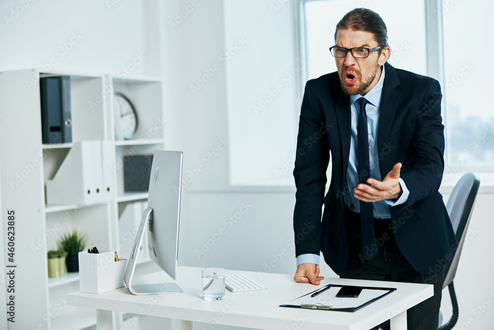 male manager in the office gestures with his hands Lifestyle male manager in the office gestures with his hands Lifestyle