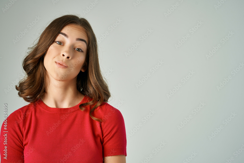 cheerful woman in a red t-shirt hair care isolated background cheerful woman in a red t-shirt hair care isolated background