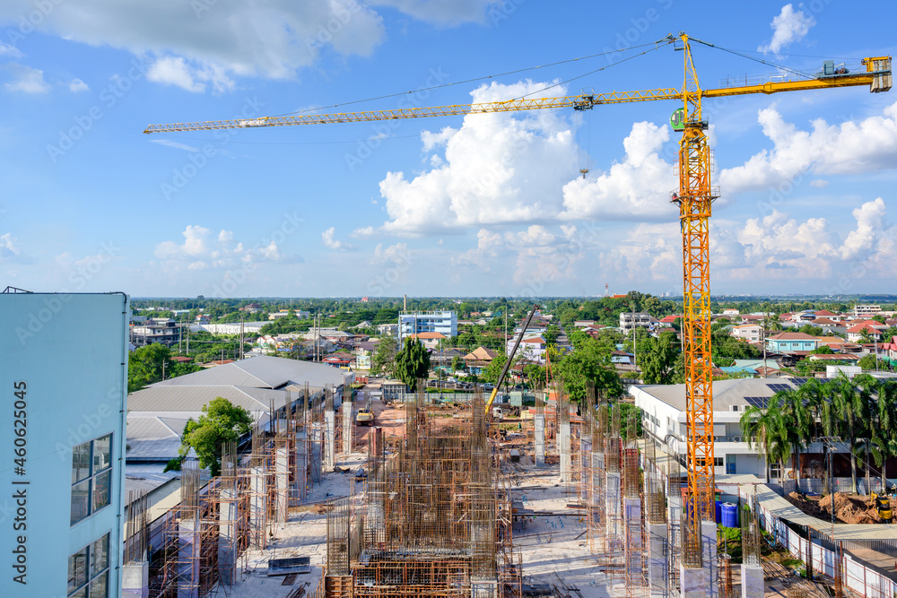 Crane on a large construction site including cranes at construction sites outside buildings a construction site with a blue sky picture from top view Crane on a large construction site including cranes at construction sites outside buildings a construction site with a blue sky picture from top view