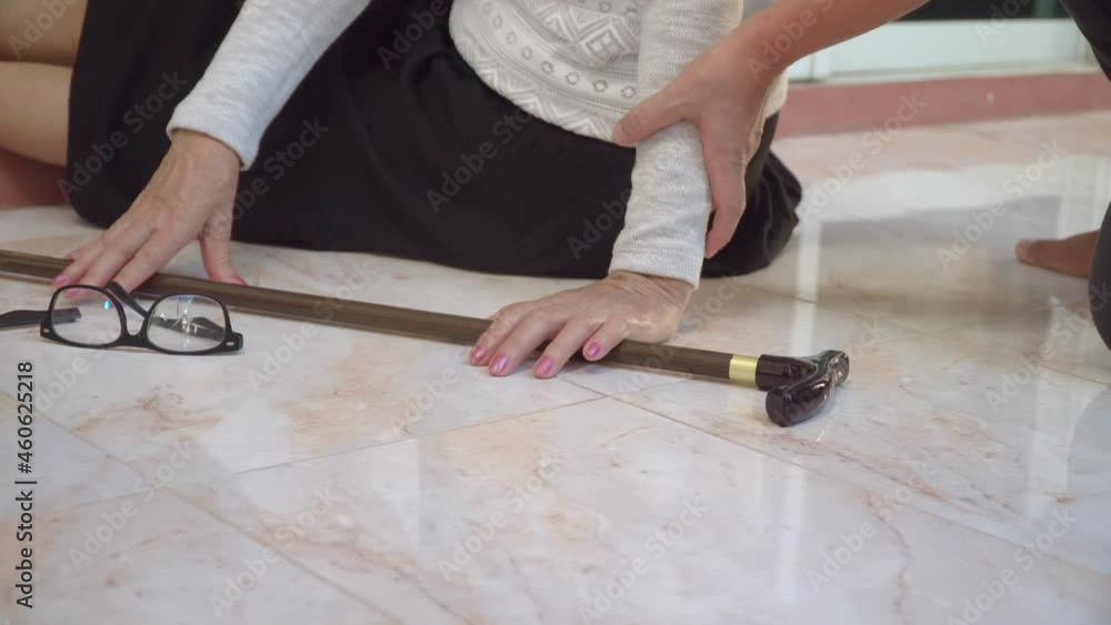 Senior woman falling down at home because stumbled on a door kerb Senior woman falling down at home because stumbled on a door kerb