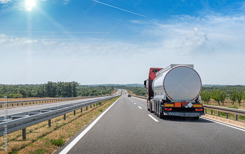 Fuel truck on the road. Truck transporting fuel on the highway.