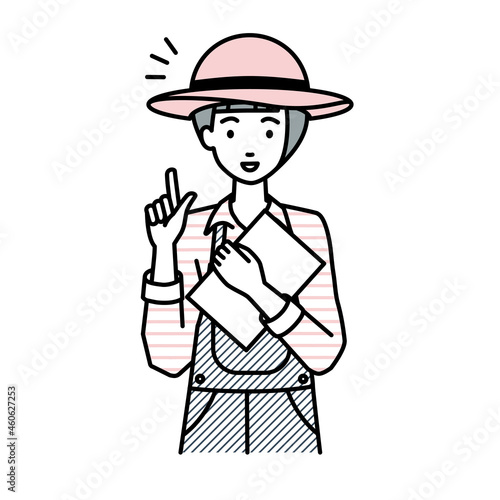 立って書類を手に持って何かひらめいた農家の女性