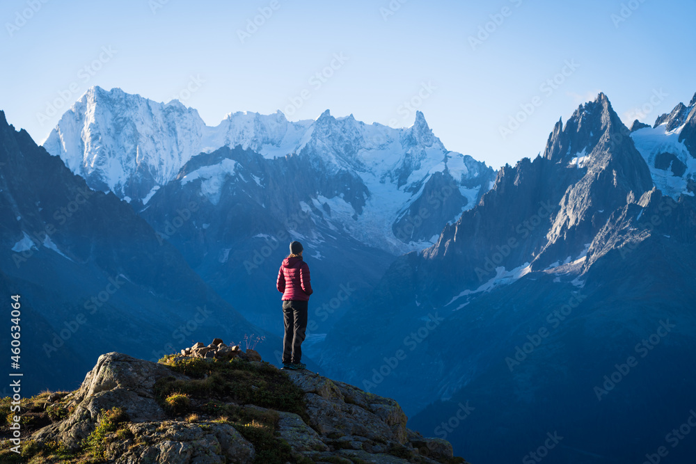 A woman looking at the mountains near Chamonix, France, on a beautiful morning.