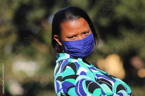 woman wear mask looking at camera