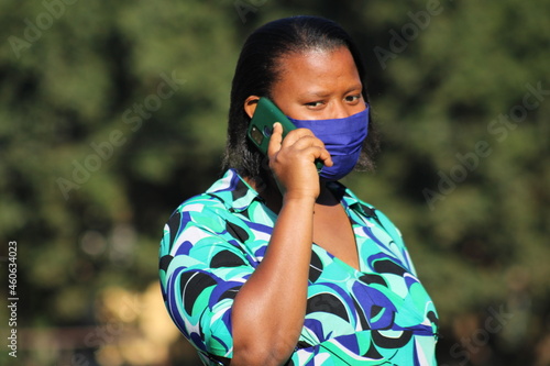 Black african woman communicate through mobile phone