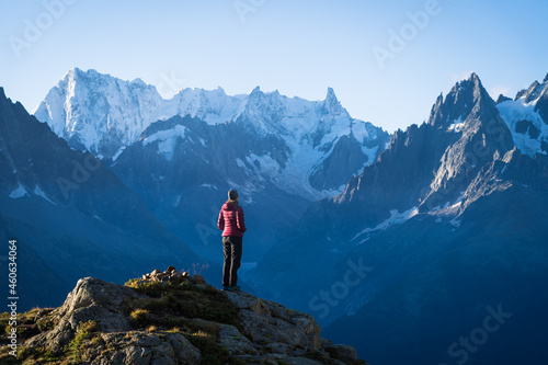 A woman looking at the mountains near Chamonix, France, on a beautiful morning.