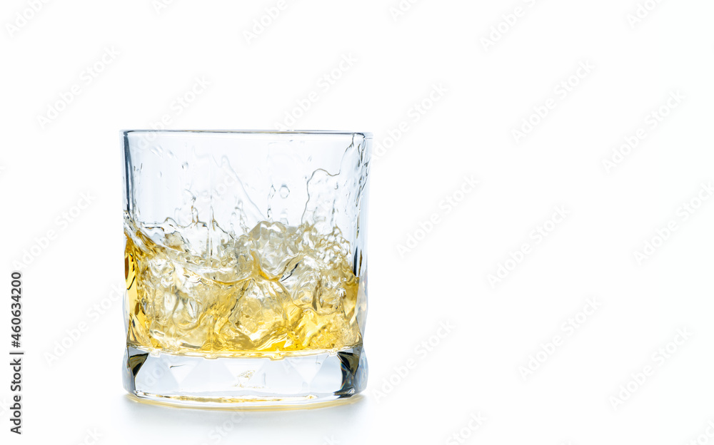 drop ice cubes in to whiskey in rock glass or Old Fashioned glass drop ice cubes in to whiskey in rock glass or Old Fashioned glass