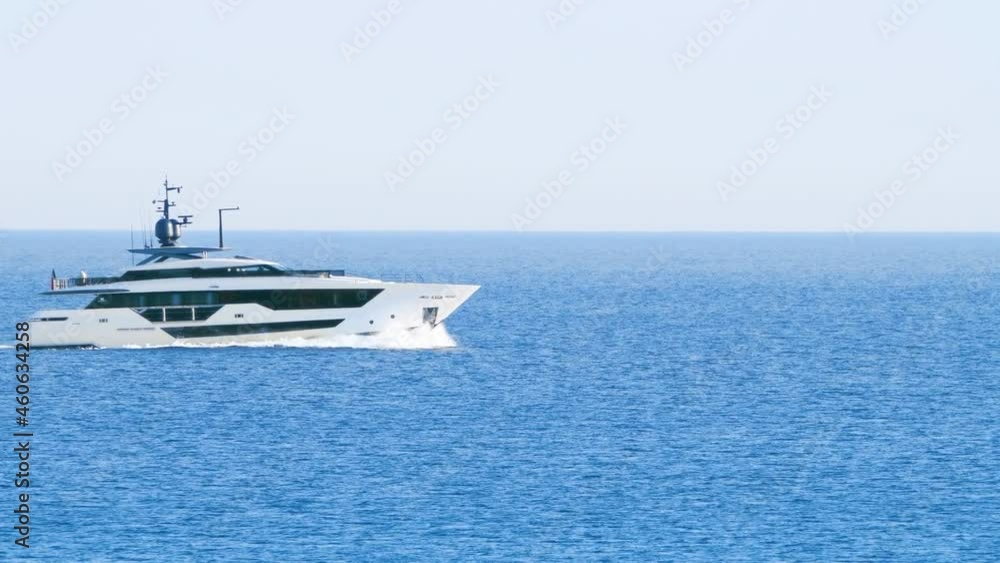 Luxury yacht cruising at open sea. View of luxury yacht cruising in turquoise lagoon. Motor Yacht sailing on open ocean Luxury yacht cruising at open sea. View of luxury yacht cruising in turquoise lagoon. Motor Yacht sailing on open ocean