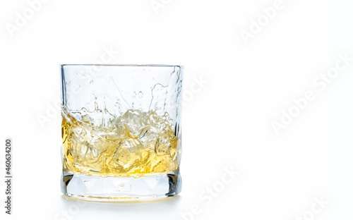 drop ice cubes in to whiskey in rock glass or Old Fashioned glass