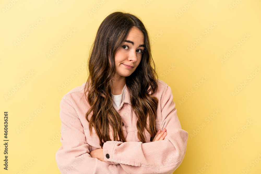 Young caucasian woman isolated on yellow background unhappy looking in camera with sarcastic expression. Young caucasian woman isolated on yellow background unhappy looking in camera with sarcastic expression.