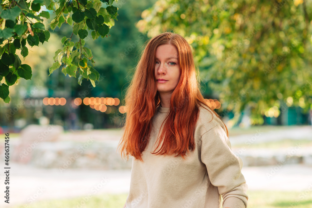 Redhead woman in autumn park Redhead woman in autumn park