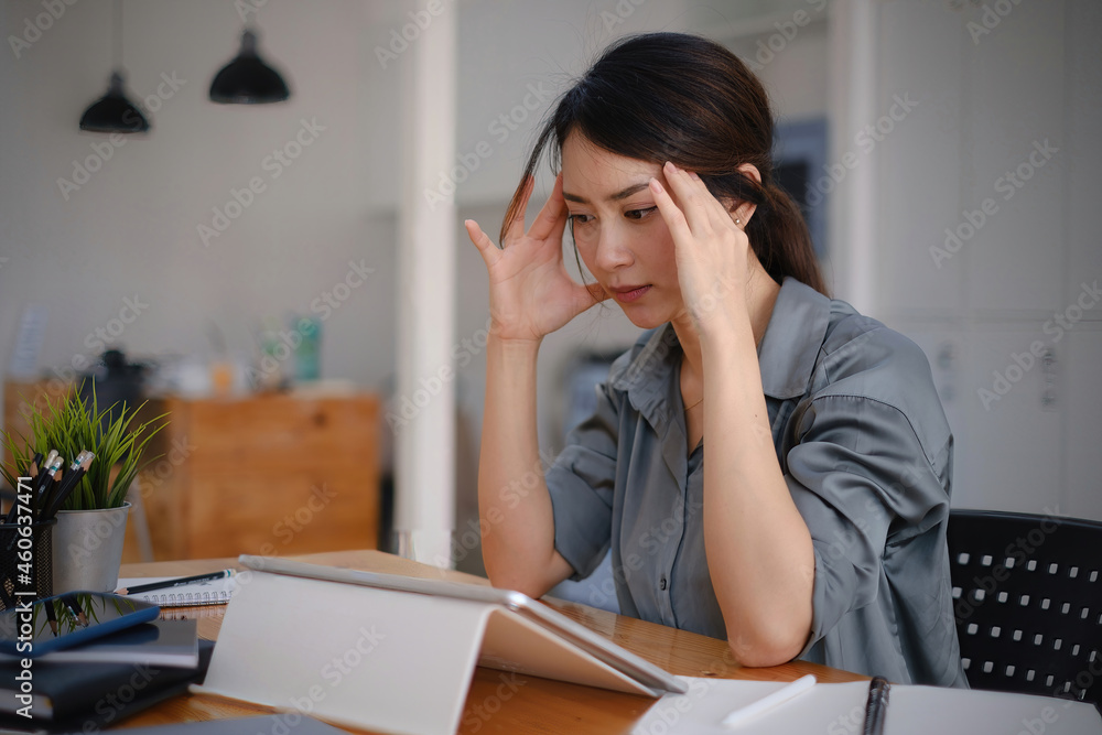 Frustrated stressed business owner or accountant sitting in an office because covid-19 has disappoint. Close business cafe shop concept. Frustrated stressed business owner or accountant sitting in an office because covid-19 has disappoint. Close business cafe shop concept.
