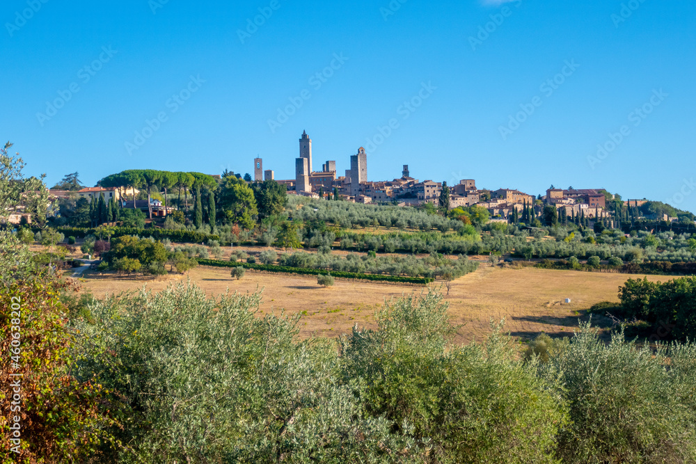 Naklejka premium Colorful skyline of little ancient town of San Gimignano, Tuscany, along via Francigena