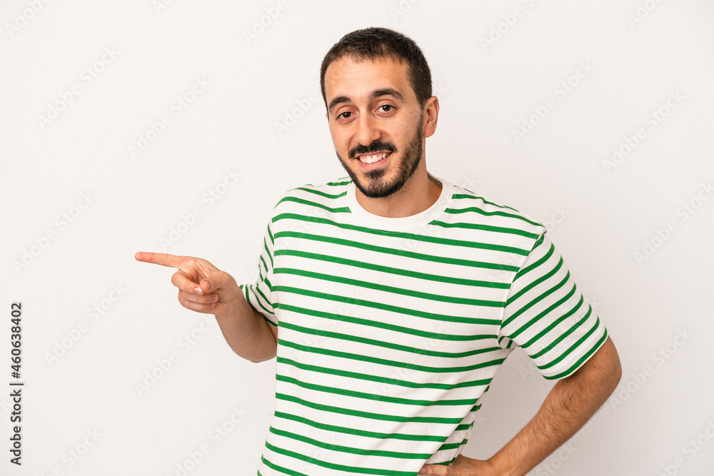 Young caucasian man isolated on white background smiling cheerfully pointing with forefinger away. Young caucasian man isolated on white background smiling cheerfully pointing with forefinger away.
