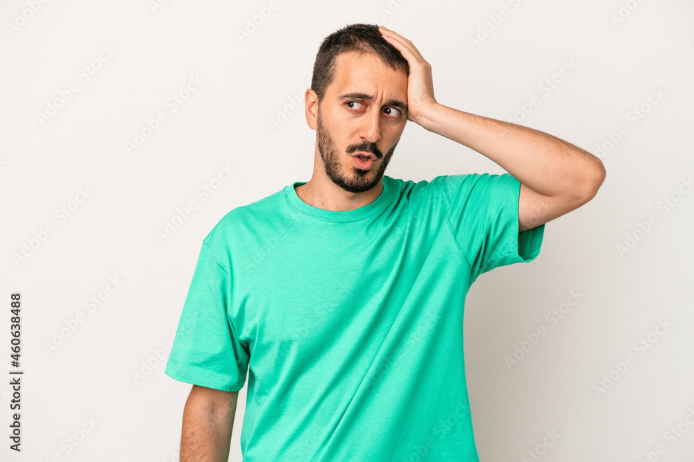 Young caucasian man isolated on white background being shocked, she has remembered important meeting. Young caucasian man isolated on white background being shocked, she has remembered important meeting.