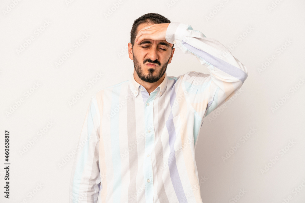 Young caucasian man isolated on white background touching temples and having headache.