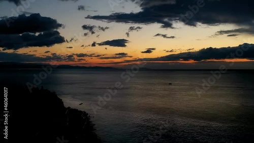 Wallpaper Mural The clouds cross slowly from left to right colored yellow orange purple blue. time lapse of clouds crossing the amazing sky over the sea or ocean at sunset. transition from day to night. Torontodigital.ca