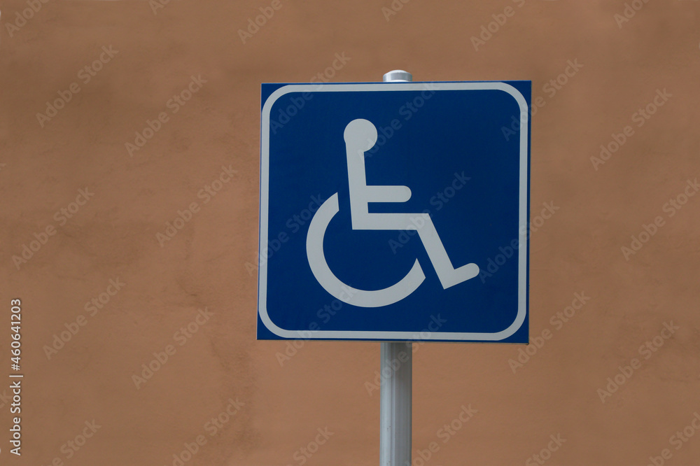 Traffic sign indicates a car park for wheelchair drivers Traffic sign indicates a car park for wheelchair drivers