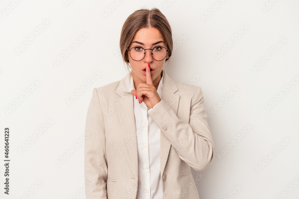 Young Russian business woman isolated on white background keeping a secret or asking for silence. Young Russian business woman isolated on white background keeping a secret or asking for silence.